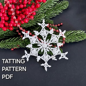 May include: White crocheted snowflake ornament with a delicate design, resting on a black background with a sprig of green pine and red berries.