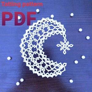 May include: A white tatting pattern in the shape of a crescent moon with a small star in the center. The pattern is on a dark blue wooden surface with white beads scattered around it. The text "Tatting pattern PDF" is in red letters at the top of the image.