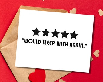 May include: A white card with five black stars and the text "WOULD SLEEP WITH AGAIN." The card is on a brown envelope with red hearts scattered around it.