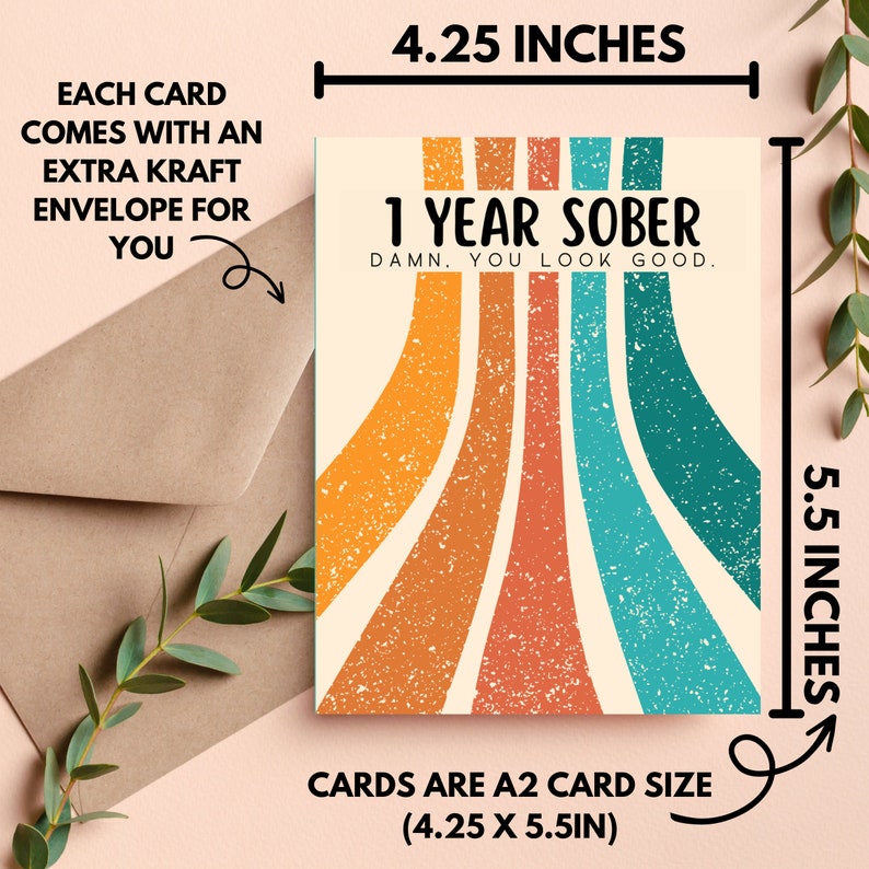May include: A greeting card with a retro rainbow design and the text "1 Year Sober. Damn. You look good." The card is 4.25 inches by 5.5 inches.