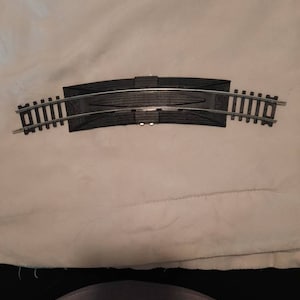 Decupler track, train track, track supplies, train supplies