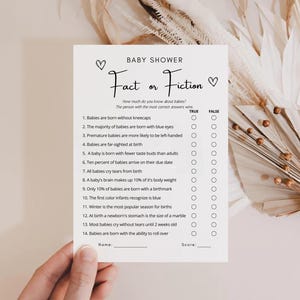 May include: A printable baby shower game with the title "Fact or Fiction" and 14 questions about babies. Each question has a true or false answer option.