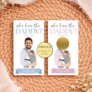 May include: Two baby shower scratch-off cards. One card shows a man holding a baby in a carrier, with the text "Who has the Daddy?" and "Find Joe!". The other card has a gold scratch-off area.