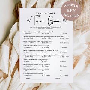 May include: A printable baby shower trivia game with 10 questions about babies. The game includes an answer key. The questions cover topics such as average weight, nappy usage, and when babies first smile intentionally.