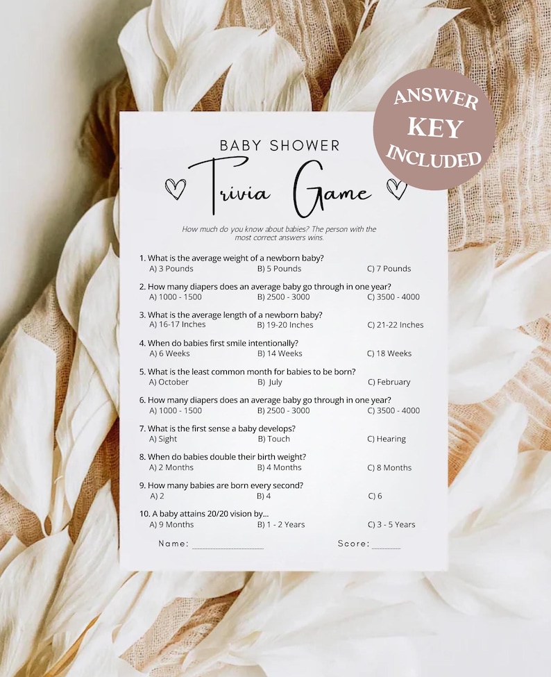 May include: A printable baby shower trivia game with 10 questions about babies. The game includes an answer key. The questions cover topics such as average weight, nappy usage, and when babies first smile intentionally.