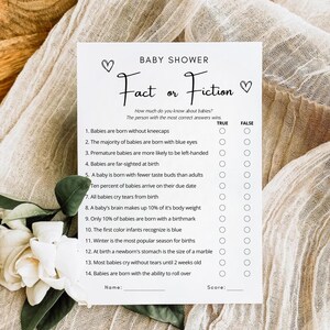 May include: A printable baby shower game titled "Fact or Fiction" with 14 questions about babies. Each question has a true or false answer option. The game includes a space for the player's name and score.