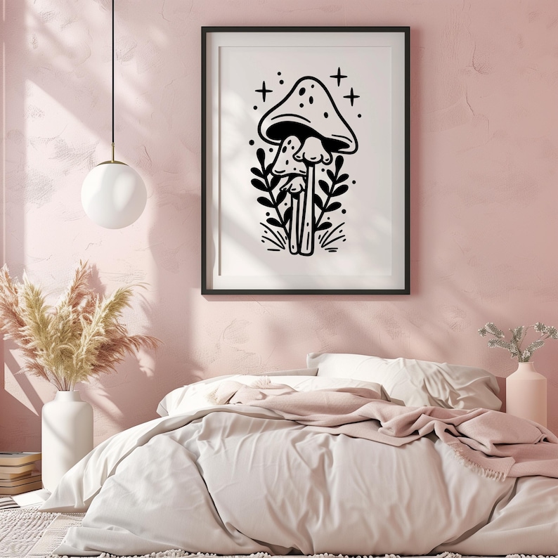 May include: Black and white illustration of three mushrooms with a simple floral design. The mushrooms are drawn in a whimsical style with a single large mushroom on top of two smaller mushrooms.