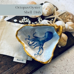 Blue octopus on a gold oyster shell dish. Octopus shell ornament for coastal home decor. Vintage octopus desk tidy paper weight gift.