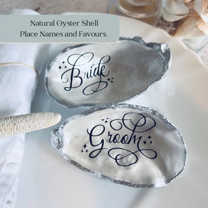 Oyster Shell Wedding Place Card and Favour. Personalised place names for your beach wedding decor. Silver coastal shell place settings.