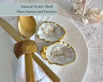 Antique gold oyster shell wedding place name and favours. Personalised name cards for bride, groom and wedding guests. Custom place names.