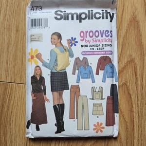 May include: Simplicity sewing pattern number 1473 for grooves by Simplicity. The pattern includes instructions for making a skirt, trousers, and a top. The pattern is for junior sizes 7/8 to 23/24 and includes extended sizes.