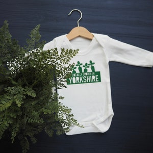 Locally grown baby outfit personalised with new baby’s own birth town, county or country. 

A custom baby onesie perfect for a homegrown newborn baby boy or baby girl.