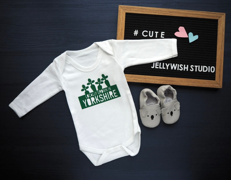 Locally grown baby outfit personalised with new baby’s own birth town, county or country. 

A custom baby onesie perfect for a homegrown newborn baby boy or baby girl.