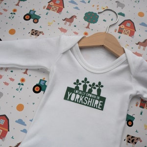 Locally grown new baby outfit personalised with baby’s own birth town, county or country. A custom baby onesie perfect for a homegrown newborn baby boy or baby girl. Could be the perfect way to announce pregnancy and welcome baby to the family.