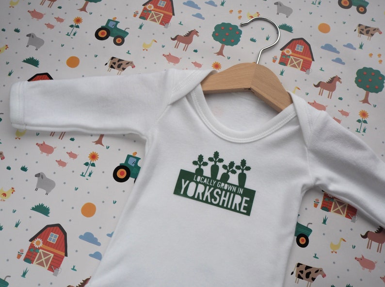 Locally grown new baby outfit personalised with baby’s own birth town, county or country. A custom baby onesie perfect for a homegrown newborn baby boy or baby girl. Could be the perfect way to announce pregnancy and welcome baby to the family.