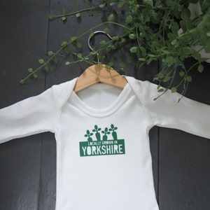 Locally grown new baby outfit personalised with baby’s own birth town, county or country. A custom baby onesie perfect for a homegrown newborn baby boy or baby girl. Could be the perfect way to announce pregnancy and welcome baby to the family.