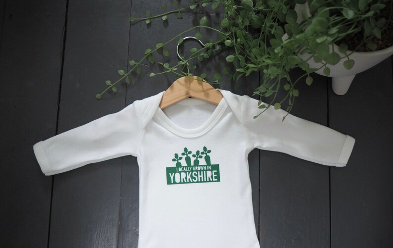 Locally grown new baby outfit personalised with baby’s own birth town, county or country. A custom baby onesie perfect for a homegrown newborn baby boy or baby girl. Could be the perfect way to announce pregnancy and welcome baby to the family.
