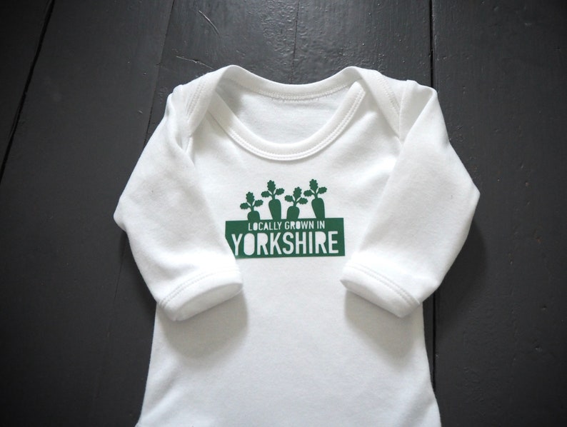 Locally grown new baby outfit personalised with baby’s own birth town, county or country. A custom baby onesie perfect for a homegrown newborn baby boy or baby girl. Could be the perfect way to announce pregnancy and welcome baby to the family.