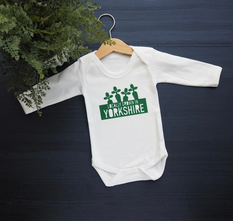 Locally grown baby outfit personalised with new baby’s own birth town, county or country. 

A custom baby onesie perfect for a homegrown newborn baby boy or baby girl.