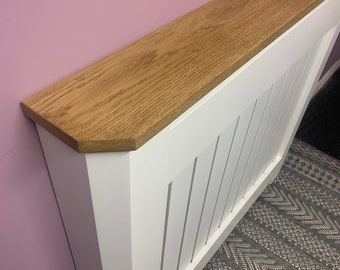 Custom radiator cover with mitred corners and Oak top.