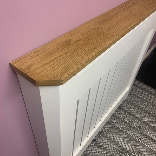 Custom radiator cover with mitred corners and Oak top.