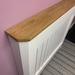 Custom radiator cover with mitred corners and Oak top.
