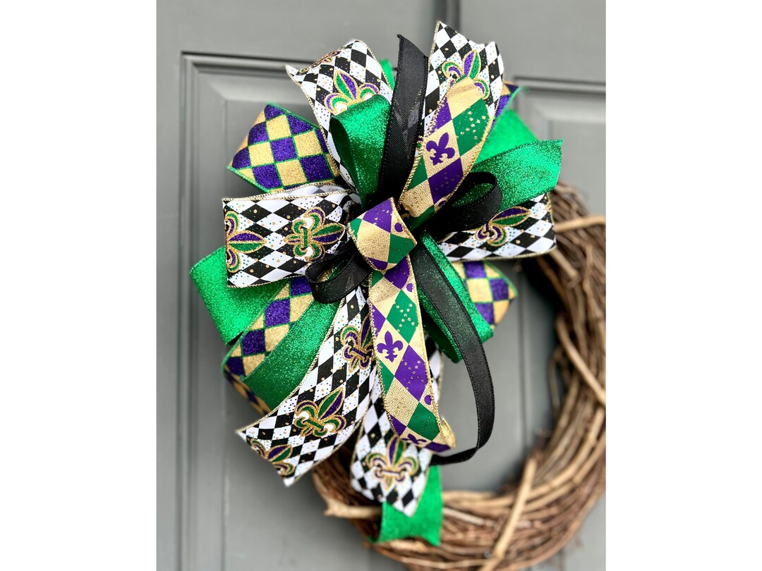Take a long piece of ribbon and bobby pin your cheer bows to it! Hang them  anywhere out of the way or for decoration:-)