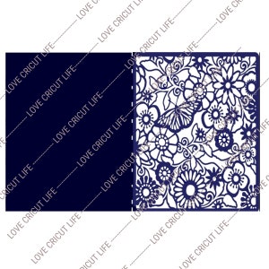 May include: A navy blue card with a floral and butterfly cut-out design. The card is open, revealing a detailed pattern of flowers, leaves, and a butterfly. The text "LOVE CRICUT LIFE" is repeated diagonally across the card.