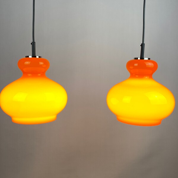 1 of 2 Bright orange glass pendant light by Peill and Putzler 1960