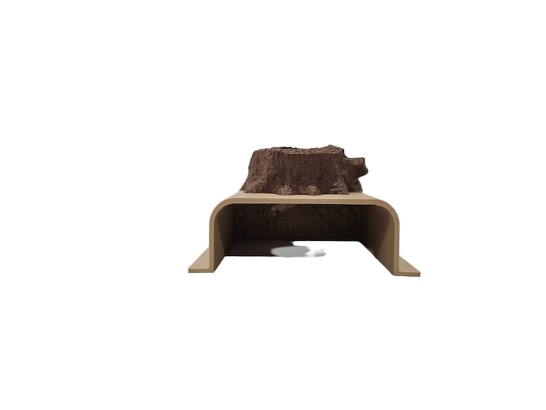 May include: A brown tree stump on a beige wooden platform with a curved opening. The platform is designed to be used as a small animal habitat.