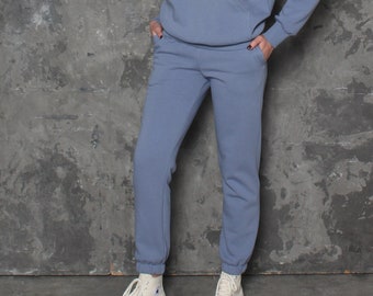 Blue jogging pants. Cuffed ladies joggers with pockets and elastic waist. Warm thick cotton jersey sweatpants. Comfy tracksuit bottoms.