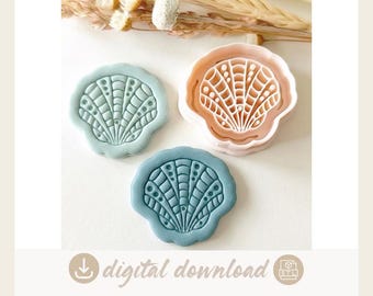 May include: Three seashell-shaped cookie cutters and stamps. One is a light peach plastic cutter, while the other two are pressed clay shapes in sage green and dusty blue, each featuring a detailed radial ribbed pattern with small circular accents.