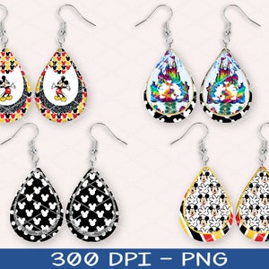 May include: Set of six teardrop-shaped earrings with various Disney-themed designs. The earrings feature Mickey Mouse, a castle, and a rainbow. The earrings are black, white, red, yellow, and blue.