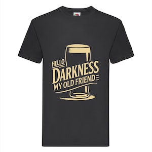 May include: Black t-shirt with a beer glass graphic and the phrase "HELLO DARKNESS MY OLD FRIEND" in a vintage style. The design is in a light tan colour. The shirt has a crew neck and short sleeves.