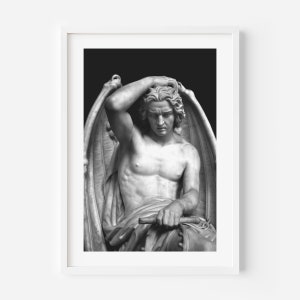 May include: Black and white photograph of a sculpture of a winged figure with a sorrowful expression. The figure is seated and has its head resting on its hand. The sculpture is made of marble and is set against a black background.