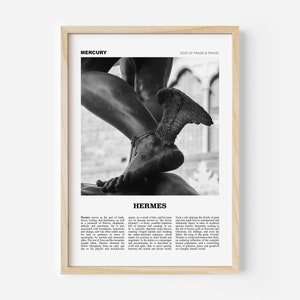 May include: Black and white framed print featuring a statue of Hermes, the Greek god of trade and travel. The image highlights the god's winged sandals and muscular legs. Text at the top reads "MERCURY" and "GOD OF TRADE & TRAVEL".