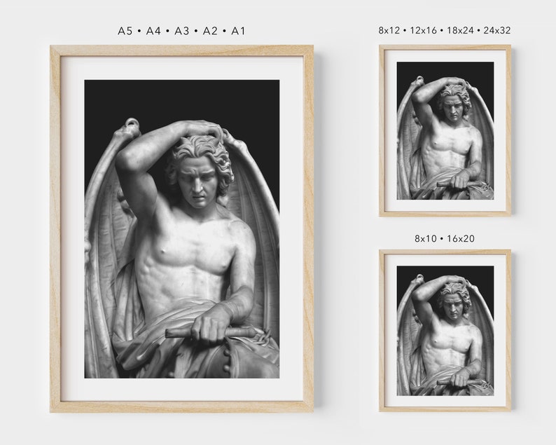 May include: Black and white photograph of a sculpture of a winged figure with a sorrowful expression. The figure is sitting with its head in its hand, and its wings are spread out behind it.