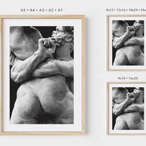 May include: Framed black and white print of a classical sculpture depicting two figures embracing. The artwork is displayed in various sizes, including 8x12, 12x16, 18x24, and 24x32 inches, with a natural wood frame.
