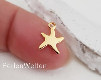 Pendentif 3 charms étoiles de mer en acier inoxydable plaqué or