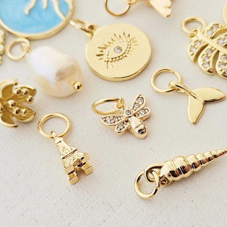 Charms vergoldet kleine Anhänger für Creolen Armbänder Eiffelturm Pilz böser Blick Seestern gold Blatt Süßwasserperle Muschel Tropfen Münze