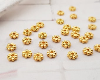 100 Daisy 4mm Fb. gold Zwischenperlen Spacer Metallperlen Scheiben Blumen Blümchen