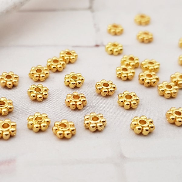 100 Daisy 4mm Fb. gold Zwischenperlen Spacer Metallperlen Scheiben Blumen Blümchen