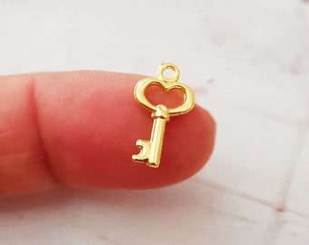 10 kleine Schlüssel Anhänger Fb. gold Charms golden Schlüsselanhänger