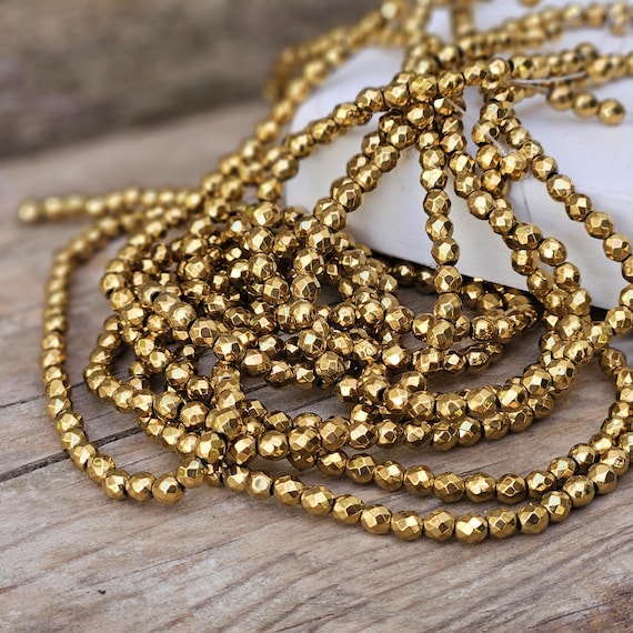 50 vergoldete Metallperlen 4mm geschliffen facettiert Armbandperlen Zwischenperlen Perlen Metall Farbe gold Effektperlen