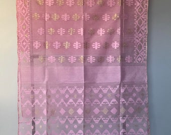 May include: A pink sheer saree with gold and pink floral patterns. The saree has a border with a geometric design.