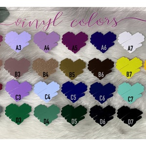 May include: A chart of vinyl colors with the text "vinyl colors" at the top. The colors are arranged in rows and columns, with each color represented by a heart shape. The colors include pink, purple, red, green, blue, yellow, orange, brown, and white.