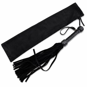 May include: Black leather flogger with a braided handle and long, flowing fringe. It includes a matching black storage bag. The handle has a loop for hanging. The design is simple and elegant.