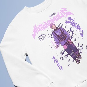 Peut inclure: Sweat-shirt blanc avec un imprim&eacute; graphique violet et noir d'un personnage d'anime avec le texte "ANIME AUTOMATON" et des caract&egrave;res japonais.