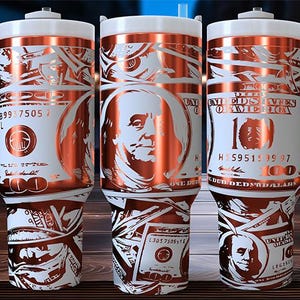 May include: Three stainless steel tumblers with a white background and a copper-coloured design of dollar bills and Benjamin Franklin's portrait. The tumblers have lids and handles.