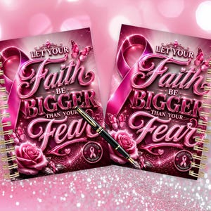 May include: Two spiral-bound notebooks featuring a pink breast cancer awareness ribbon, roses, and butterflies. The text reads, Let Your Faith Be Bigger Than Your Fear. A black and gold pen rests diagonally across the notebooks on a glittery background.